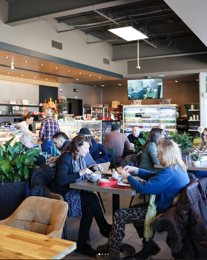 Guests dining inside Joy Foods café in Etobicoke
